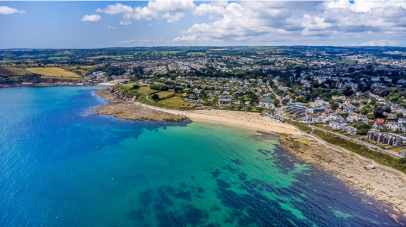 An aerial view of Gyllyngvase Beach during the height of summer